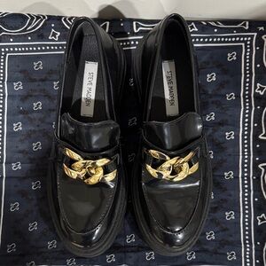 Steve Madden Glossy Black Loafers with Gold Accent